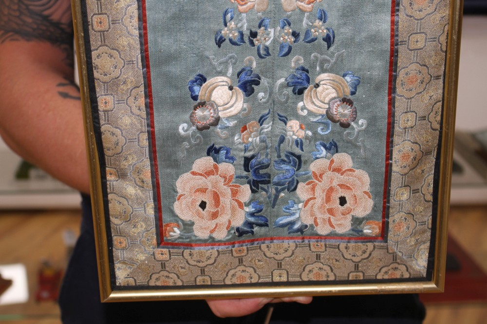 A Chinese silkwork double sleeve panel, 77 x 18cm overall, a smaller floral panel, 61 x 11cm and another, 34 x 26cm overall